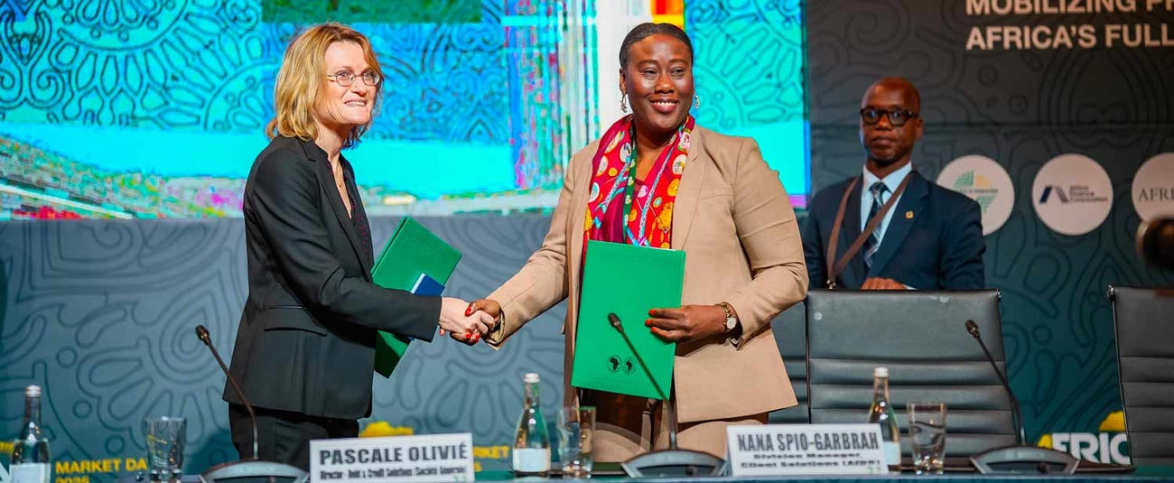 AfDB Division Manager Nana Spio-Garbrah (right) and Societe Generale (SG) Senior Advisor Pascale Olivié signed an agreement for SG to serve as lead advisor on the AfDB's Synthetic Securitization Platform